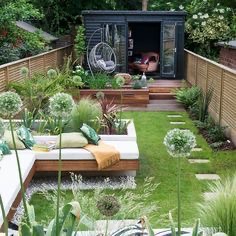 Garden room, lawn and stepping-stone path at dusk
