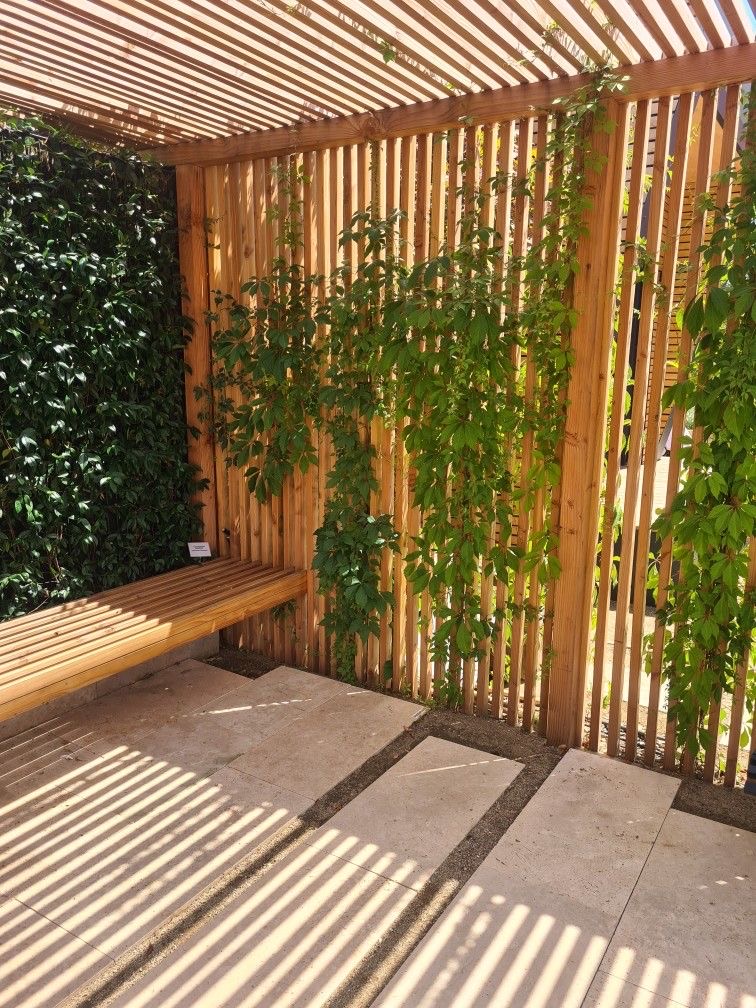Outdoor kitchen under a woven pergola roof