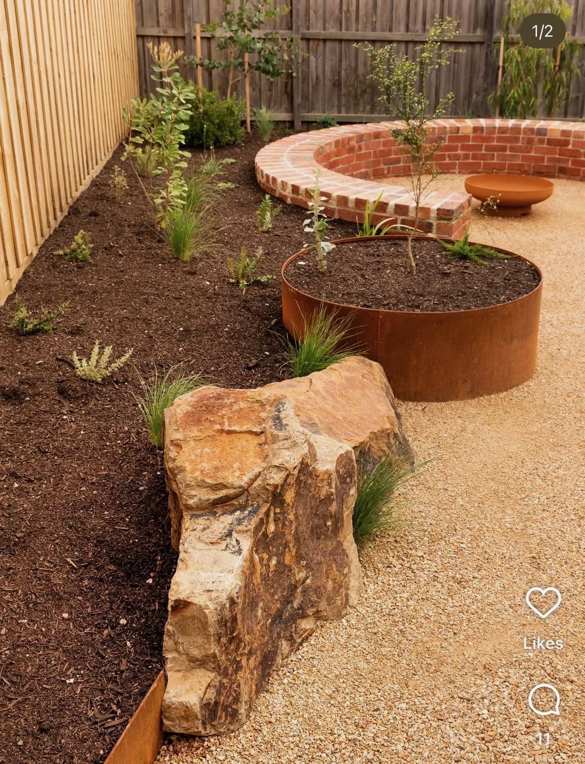Curved brick wall, corten planter and fire bowl