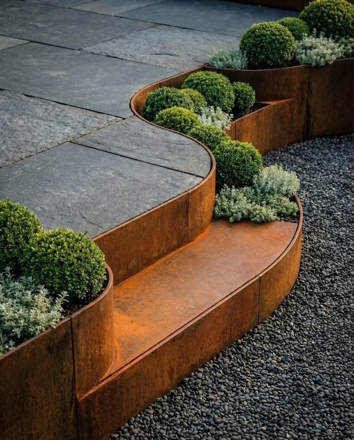 Corten planter wall with ornamental grasses