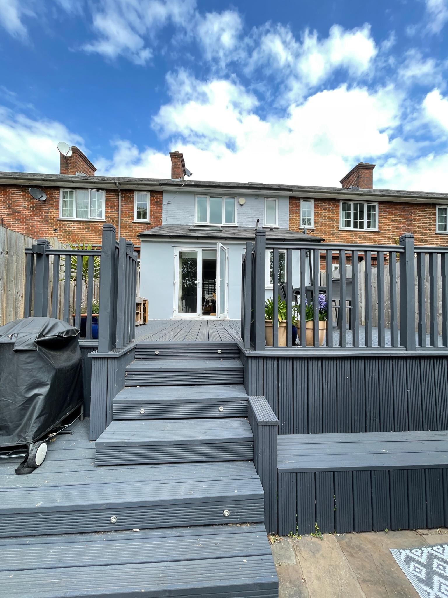 Existing deck steps and rear elevation of the house
